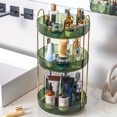 three tiered shelf with bottles and cosmetics on it