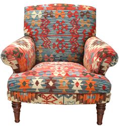 an upholstered chair with colorful patterns on it