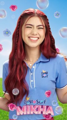 a girl with long red hair is wearing a blue shirt and has bubbles floating in the air