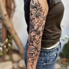 a woman with a flower tattoo on her arm