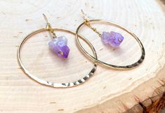 Gorgeous light weight large gold hoops with 100% real Amethyst stones. 14k gold plated lightweight hoops. Perfect boho chic look and February birthday gifts! Regular hoops- texture ridges Hammered hoops- beautiful rustic hand hammered detailing. Please see photo. 💜Amethyst crystals are potent stones to aid healing and they bring intense spiritual growth. ♥ Increases nobility ♥ Spiritual awareness ♥ Psychic abilities ♥ Inner peace and healing ♥ Healing of body, mind & soul ♥ Positive transfo 14k Gold Filled Gemstone Hoop Earrings, Gold Hoop Spiritual Jewelry, Spiritual Hoop Earrings With Ear Wire, Spiritual Hoop Jewelry As Gift, Adjustable Gemstone Hoop Jewelry, Gold Gemstone Dangle Hoop Earrings, Gold Dangle Hoop Earrings With Gemstone, Minimalist Gemstone Hoop Jewelry, 14k Gold Filled Dangle Hoop Earrings With Gemstone