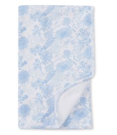 a blue and white floral print blanket