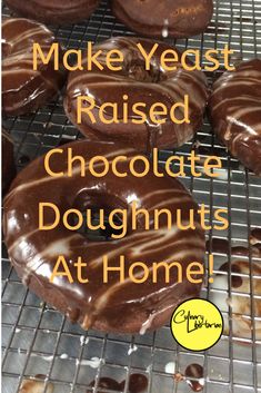 chocolate doughnuts on a cooling rack with the words make yeast raised chocolate doughnuts at home