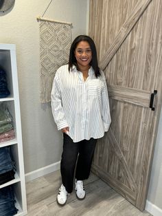 Rock the oversized look with this boyfriend-style white and black striped cotton button up shirt. Made from high-quality cotton, this shirt combines comfort and style effortlessly. Perfect for a casual day out or a fun night in. This is definitely an oversized shirt. I'm wearing a size large, but I could easily (and probably should have) sized down to a medium. I wanted to show what it looks like when wearing my true size. This is 100% cotton, so you'll need to wash it in cold and hang to dry for it to not shrink. Casual Shirt With Striped Collar For Day Out, Trendy Striped Shirt For Day Out, Striped Shirt For Everyday In Fall, Striped Shirt For Everyday Fall Wear, Everyday Striped Shirt For Fall, Vertical Stripes Button-up Shirt For Day Out, White Relaxed Fit Shirt With Vertical Stripes, Trendy Relaxed Fit Striped Shirt, Chic White Shirt With Vertical Stripes