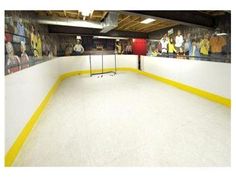 an indoor hockey rink with yellow and white lines