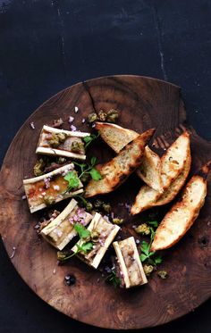 grilled tofu on a wooden plate with garnishes