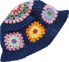 a crocheted hat with multicolored flowers on the front and back side