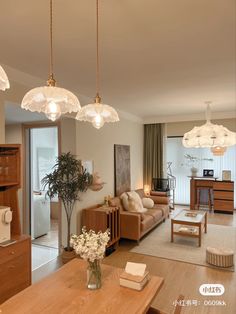 a living room filled with furniture and lots of lights hanging from it's ceiling