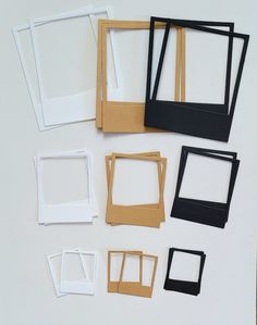 several pieces of paper are placed next to each other on a white surface with black and white frames