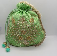 "ethnic traditional indian wedding gota patti zardosi embroider potli bag handbag for woman | potli bag for return gift | indian wedding gift Package Contents: 1 Size: 10\" x 8\" Designed with the heart, this beautiful Potli or batawa bag are eye catchy and made of premium material. Key Features: Ark Work. This potli is good match with both Indian and western outfits and are superb for wedding and festive parties. This would be best complement to your designer saree, lenhga or any other kind of Green Potli Bag For Wedding, Elegant Green Potli Bag For Festivals, Green Zari Work Potli Bag For Wedding, Gold Potli Bag With Mirror Work For Gift, Green Bag With Zari Work For Wedding, Elegant Green Potli Bag For Festive Occasions, Green Festive Potli Bag For Wedding, Festive Green Potli Bag For Wedding, Diwali Wedding Bag With Mirror Work