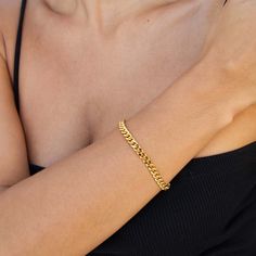 Thick curb chain bracelet in 18k gold-plated brass. 18k gold-plated brass 6.5'' length 5mm width Hot Blouse Designs, Braclets Gold, Curb Chain Bracelet, Stackable Jewelry, Bridal Fashion Jewelry, Fashion Illustration Dresses, Jewelry Accessories Ideas, Gold Bracelet For Women, Accessories Ideas