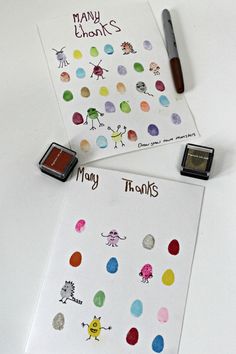 two sheets of paper with different colored dots on them next to a stamper and marker