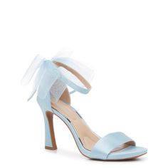 Show off your graceful look with these women's Kelly & Katie Nemira baby blue evening sandals. Crafted from fabric and synthetic upper, these high heel evening sandals are styled with a round open toe and an adjustable ankle strap with buckle closure for a secure. The beautiful bow accent at the heel counter adds elegance and femininity. A synthetic lining and padded footbed provide comfort while chunky block heel and fabric-flocked synthetic sole offer enhanced elegance and stability. This style is exclusive to Designer Brands Canada. | Kelly & Katie Women's Nemira Evening Sandal in Baby Blue Size 6 Medium Bridal Wedding Shoes Blue, Bow Back Shoes, Blue Bridal Shoes Block Heel, Powder Blue Heels, Light Blue Heels Wedding, Light Blue Platform Heels, Something Blue Wedding Shoes, Blue Wedding Accents, Bloom Outfits