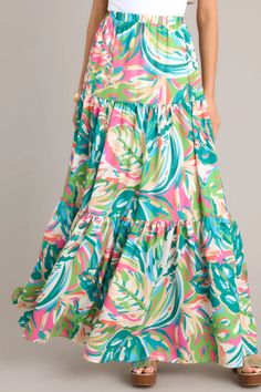 Add a touch of tropical paradise to your wardrobe with our Oceanic Mirage Teal Tropical Print Maxi Skirt. This playful and versatile skirt features a vibrant teal print and a flowing maxi length for a fun and breezy look. Perfect for any occasion, from beach days to brunch dates! This skirt features a high waisted design, an elastic waistband, a colorful & unique print, a tiered design, and flowing material. Print Maxi Skirt, Printed Maxi Skirts, Tropical Paradise, Beach Days, Printed Maxi, Tropical Print, Unique Print, Beach Day, Spring Summer Fashion