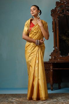 Light yellow gold handwoven saree crafted in kosa silk featuring flower and leaf motif. Comes with a running blouse piece. - Aza Fashions Yellow Handloom Pre-draped Saree For Wedding, Gold Anarkali Pre-draped Saree In Traditional Drape, Festive Gold Katan Silk Blouse Piece, Gold Raw Silk Saree With Unstitched Blouse, Gold Handloom Lehenga In Tussar Silk, Gold Katan Silk Blouse Piece With Self Design, Gold Art Silk Blouse Piece For Saree, Gold Raw Silk Pre-draped Saree With Self Design, Traditional Gold Handloom Blouse Piece