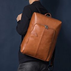 This laptop bag comes with a double-joint shoulder strap ensuring you carry it with ease. It is crafted of genuine leather and has a solid pattern that makes it hard to resist. Showcasing an incredible finish, this laptop bag features a zipper closure to keep your contents safe and is also water-resistant which makes up for a positive point.SpecificationsWith/without interlining: YesWith or without back cotton cushion: YesTexture: CowhideStyle 2: RetroStyle: BusinessSize: LargeShoulder Strap Sty Brown Leather Backpack With Zipper For Daily Use, Luxury Business Backpack With Large Capacity, Brown Leather Satchel Backpack With Zipper, Classic Brown Backpack With Zipper Closure, Brown Faux Leather Backpack With Zipper Closure, Large Capacity Leather Business Backpack, Classic Large Capacity Rectangular Leather Backpack, Office Laptop Backpack With Adjustable Strap, Brown Faux Leather Rectangular Backpack