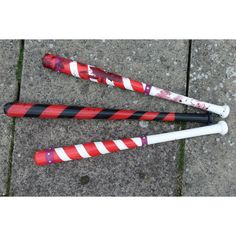 three red and white umbrellas laying on the ground