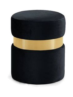 two black velvet stools with gold trim around the top and bottom, one on each side