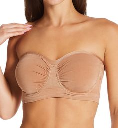 Soft strapless bra is knit for a comfortable stretch fit and easily changes shape to give you a perfect fit. Made of nylon and spandex. Seamless underwire cups are self lined with built-in pockets for removable padding, included. Cups are dual layers of 4-way stretch knit with ruching at the center and sides so that fit expands. Sweetheart neckline has a ribbed edge for flexible fit. Silicone grippers along the inner edge of the neckline (near center), keep cups from slipping. Ribbed 2-layer bas Strapless Nylon Tube Top With Built-in Bra, Strapless Tube Top With Built-in Bra, Stretch Tube Top With Built-in Bra And Underwire, Strapless Seamless Shapewear, Micro-elastic Strapless Bra-friendly Tube Top, Seamless Stretch Tube Top With Underwire, Solid Color Bandeau Sports Bra With Built-in Bra, Micro-elastic Seamless Strapless Tube Top, Bandeau Shapewear With Medium Bust Support