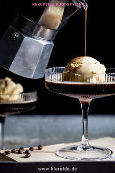 an ice cream sundae with coffee being poured into it