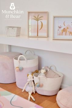 there are baskets and toys on the shelf in this child's room, which is decorated with pastel colors