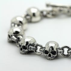 SKU: i3698 Beautiful bracellet with skull and bones parts. Features: Brand new sterling pendant silver 925. Not plated, 100% solid silver metal! The average weight of the product - 57.0 g. (22.5cm Lenght); Processing - Blacked oxidation; Availability of proprietary tag manufacturer - Yes; Country of origin - Ukraine; FAQs about Bracelet Fit - https://www.overstock.com/guides/faqs-about-bracelet-fit More products on www.indigo.jewelry Online Cataloque www.indigo.shop Silver Gothic Skull Bracelets, Classic Sterling Silver Skull Jewelry, Sterling Silver Skull Jewelry With Polished Finish, Indigo Jewelry, Sterling Pendant, Average Weight, Unisex Bracelets, Mens Silver Rings, Unisex Ring