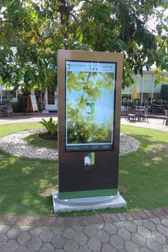 a digital sign in the middle of a park