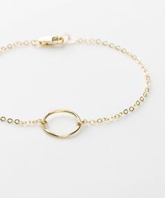 "Dainty Open Circle Bracelet gift, in 14k Gold Fill, Silver or Rose Gold. Beautiful hand-hammered finish. This subtle and dainty bracelet is the perfect gift to give to your loved ones. They'll never stop thanking you. :) D A I N T Y ∙ O P E N ∙ C I R C L E ∙ B R A C E L E T D E T A I L S * 100% 14k Gold Filled, Sterling Silver, or 14k Rose Gold Filled * All raw materials are USA sourced * Open circle charm is 11mm I T ' S ∙ A W E S O M E * Ethically Sourced, USA raw materials * Our lovely packa Minimalist 14k Gold Filled Round Bracelets, Minimalist 14k Gold-filled Round Bracelets, Minimalist 14k Gold Filled Round Bracelet, 14k Gold Filled Round Bracelets As Gift, Gold Circle Bracelets For Everyday, Minimalist Round Gold Bracelet For Everyday, Dainty Adjustable Circle Bracelets, Adjustable Dainty Circle Bracelets, Delicate Chain Round Gold Bracelet Gift