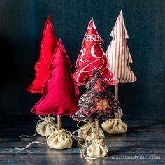 three small christmas trees sitting on top of each other