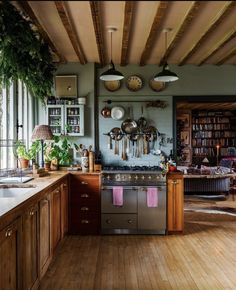 a kitchen with wooden floors and lots of counter space