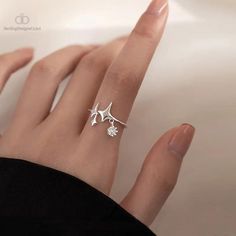 Indulge in celestial charm with our Shiny Star Cross Irregular Crystal Rings for Women. Each piece is a masterpiece of contemporary elegance, featuring a unique star-cross design adorned with dazzling crystals. The irregular shape adds an avant-garde touch, making it a perfect accessory for fashion-forward individuals. Crafted with precision and attention to detail, these rings are not just jewelry; they're a statement. The sparkling crystals catch the light, creating a mesmerizing effect that complements any outfit. The adjustable design ensures a comfortable fit, making it suitable for various occasions, from casual outings to special events. Elevate your style and express your individuality with this timeless piece. Whether you're treating yourself or searching for the perfect gift, our Luxury Rings, Star Decorations, Star Jewelry, Charm Rings, Shining Star, Star Ring, Sterling Silver Bands, Crystal Rings, Ring Ring