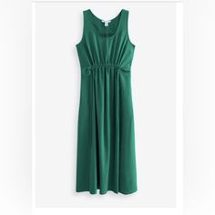 Echo Dress By Athleta In A Beautiful Emerald Green Color. Size M. Style 601555. Drawstring Waist. Pull On Style. Measures Approx 42” Bust And 49” Length. Side Pockets. 68% Polyester, 30% Recycled Polyester, 2% Elastane. Dress Is In Excellent Condition, Worn Once, Looks Brand New. For: Commuting, Work And Travel. Fit: Ruching Detail At The Waist. Scoop Neck. Sleeveless. Relaxed With Room To Move. Mini Length, Hits At The Calf. Feel: Lightweight, Comfortable, Perfect For Versatile Dressing. Breath Casual Solid Dresses For Workout, Sporty Sleeveless Solid Dress, Casual Green Sleeveless Dress, Sleeveless Summer Sports Dress, Green Athleisure Spring Dress, Spring Green Athleisure Dress, Green Stretch Workout Dresses, Solid Sleeveless Dress For Workout, Athleisure Sleeveless Tank Top For Vacation