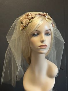 This little treasure is original, never used before straight from the box . French 'BIBI' very Grace Kelly style adapted as a bridal head piece. Small little  chrysanthemum flowers. Several   shadows of beige, rose brown velvet ribbon and green leaves..  supper light you can wear as a hat on top of your head and  back of the head. The veil is very short in dark ivory and it is  attached to the piece.  I did in Ivory to keep it just One Ivory Vision. The veil is 23 in long. Vintage Pinched Crown Headpiece For Weddings, Vintage Fascinator Headband For Church, Vintage Headband Fascinator For Church, Adjustable Vintage Fascinator For Wedding, Vintage Church Fascinator With Headband Shape, Vintage White Headpiece For Church, Vintage White Headpieces For Wedding, Vintage White Headpieces For Church, Vintage Wedding Headpiece With Pinched Crown