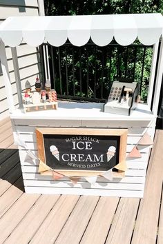 an ice cream stand on a wooden deck