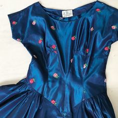 "This is a pretty taffeta royal blue/cobalt 1950s dress with little embroidered rose bouquets on the bodice. Drop waist (which doesn't work for shortie me) Bust 34\" Waist 24/25\" This item is clean and ready to wear. It has been professionally dry-cleaned. Comes from a smoke and pet free home. Don't forget to follow me on Instagram @tammaraclearshercloset for new listing alerts This is shipping from Singapore. Standard post to the US takes about 10 working days. Please contact me if you need it Japanese Princess, Peacock Dress, Embroidered Rose, Blue Cobalt, Tea Length Dresses, 1950s Dress, Rose Dress, Lucky Girl, Drop Waist