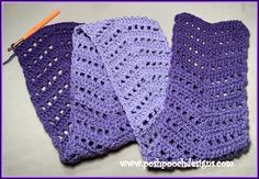 three purple crocheted dishcloths are laying on the table next to each other