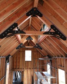 the inside of a wooden building with scaffolding