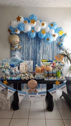 a baby shower party with blue and white decorations