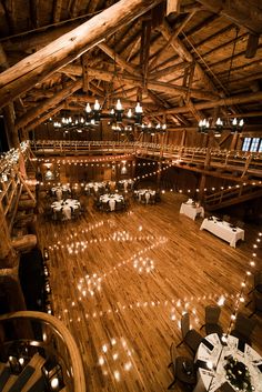 an overhead view of a wedding venue with lights on the floor and tables set up