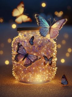 a jar filled with lots of butterflies sitting on top of a table next to some lights