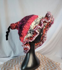 Looking for something warm and unique? This is the perfect hat for you! Made from a variety of pinks and black. This large hat is going to be super cozy all winter long. Great for going out or sitting inside all winter wrapped up and watching your favorite witchy movies!  Laid flat it is 12 inches across. Winter Curved Brim Bonnet, One Size, Winter Bonnet With Curved Brim, One Size, Winter Curved Brim Bonnet One Size, Cozy Warm Pink Hats, Adjustable Pink Hat For Fall, Cozy Pink Beanie Hat, Whimsical Pink Crochet Hat For Winter, Fun Pink Hat, One Size, Cozy Pink Crochet Beanie Hat