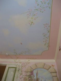 the ceiling is painted pink and has flowers on it