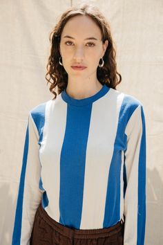 We’re not sure exactly what sport we’re playing here, but everyone is welcome on team Nikki Chasin. The Copa Striped L/S T is a custom-knit, unisex shirt that gives funky referee vibes. As per usual, you can wear it casual with overalls or make it elevated with our Puff Skirt. We’re excited to see our team out in the wild. Be sure to check out the short sleeve version, the Salma Striped T. Made in China. Puff Skirt, Florida Woman, Everyone Is Welcome, Striped Long Sleeve Tee, Work Outfits, Vintage Jeans, Sweater Weather, Striped Long Sleeve, Unisex Shirt