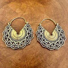 Dive into the mesmerizing world of sacred geometry with our Handcrafted Mandala Hoop Earrings. Intricately designed and expertly crafted, these earrings showcase the timeless beauty of mandala patterns, offering a perfect balance of elegance and spirituality. Material: High quality solid brass Width: 1.5 inch Length: 2 inches  🌀✨ **Key Features - **Artisanal Craftsmanship Each pair is meticulously handcrafted, ensuring intricate details that bring out the essence of mandala patterns. - **Sacred Intricate Brass Hoop Earrings, Geometric Brass Earrings For Gift, Brass Festival Jewelry, Handmade Geometric Brass Jewelry, Gold Circle Jewelry For Festivals, Gold Circular Jewelry For Festivals, Gold Circular Festival Jewelry, Bohemian Geometric Gold Jewelry, Nickel-free Geometric Brass Earrings