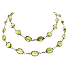 This elegant necklace is made of a single strand of 20 inches of alluring peridots set in 18K white gold. The unique green of the peridot is what makes this necklace so captivating. The peridot, also known as the stardust gem, is one that never fails to steal attention – the wearer of this necklace is sure to turn heads with this beautiful masterpiece. Luxury Gold Peridot Necklaces, Green Peridot Necklace In Fine Jewelry Style, Fine Jewelry Peridot For Formal Occasion, Formal Fine Jewelry With Peridot, Formal Peridot Jewelry For May Birthstone, Elegant Lime Green Sterling Silver Jewelry, Elegant Lime Green Gemstone Necklace, Elegant Lime Green Faceted Jewelry, Green Single Strand Necklace For Formal Occasions