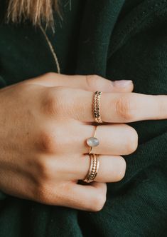 Our Dori ring is made with a gorgeous Labradorite stone. This mystical gemstone is believed to enhance mental clarity and bring about transformation. It's a crystal connected to the third eye chakra which is our gateway to inner wisdom and deeper intuition. 8mm round or 6x8mm oval faceted labradorite stone. Ring band measures 1mm wide. Available in 14kt Gold Fill + Sterling Silver. KJ pairs it with our Sonder Ring, Raye Ring, and Confetti Ring. Also shown with our Dylan Chain Ring and Wrap Ring. Copper Uses, Everyday Wear Jewelry, The Third Eye, Inner Wisdom, Third Eye Chakra, Mental Clarity, Labradorite Stone, Wrap Rings, Jewelry Cleaner