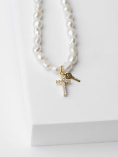 16" Freshwater Pearl chain with 2" extender Lobster clasp closure Chain features a mini Pavé Cross and a mini key charm engraved with GRACE Not available for customization Giving Keys, Cell Phone Charms, Key Jewelry, Freshwater Pearl Bracelet, Key Necklace, True Red, Oval Pendant, Pearl Chain, Simple Necklace