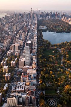 an aerial view of the city and lake