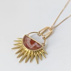 This stylish Full Of Hope necklace is made of brass and hand painted resin, creating a unique piece of jewelry with lots of movement yet remaining lightweight. The 18 inch gold-plated chain adds the finishing touch. Gold Agate Wire Wrapped Necklace, Gold Agate Wire Wrapped Jewelry, Adjustable Gold Carnelian Necklace, Gold Wire-wrapped Agate Jewelry, Gold Wire Wrapped Carnelian Jewelry, Artisan Gold Carnelian Jewelry, Bohemian Gold Carnelian Jewelry, Artisan Carnelian Gold Jewelry, Gold Agate Jewelry With Large Pendant