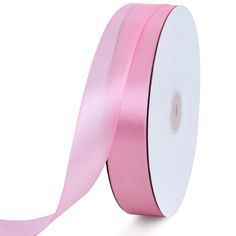 a pink satin ribbon on a white background